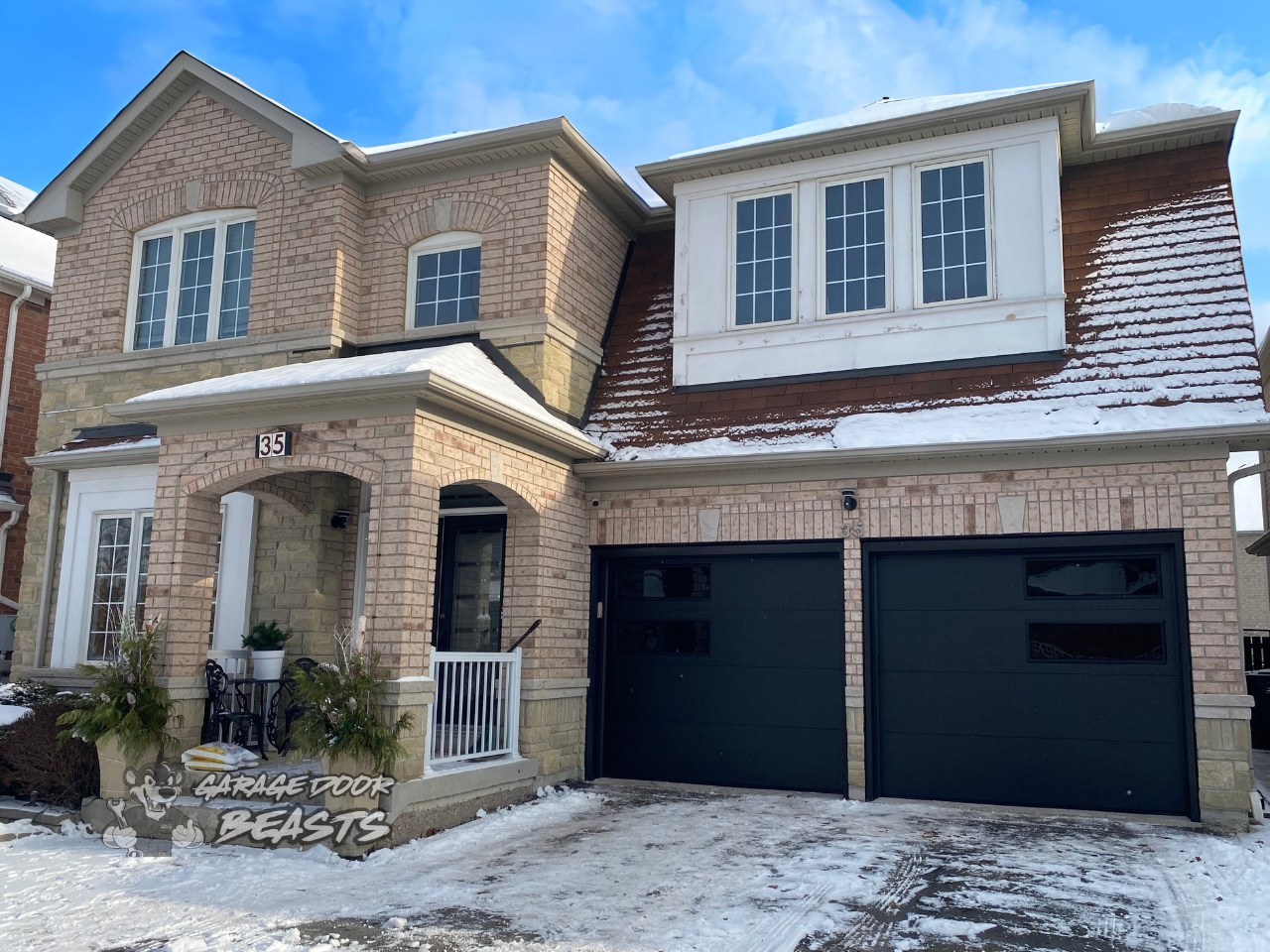 8'x7' Garage Door Installation - Black Flush Panel with 2 Black Tinted Windows on the Side - Garage Door Beasts