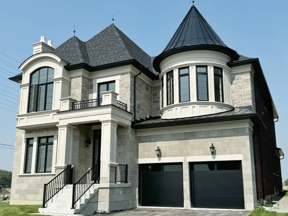 Black modern flush garage doors with windows on a home in Aurora