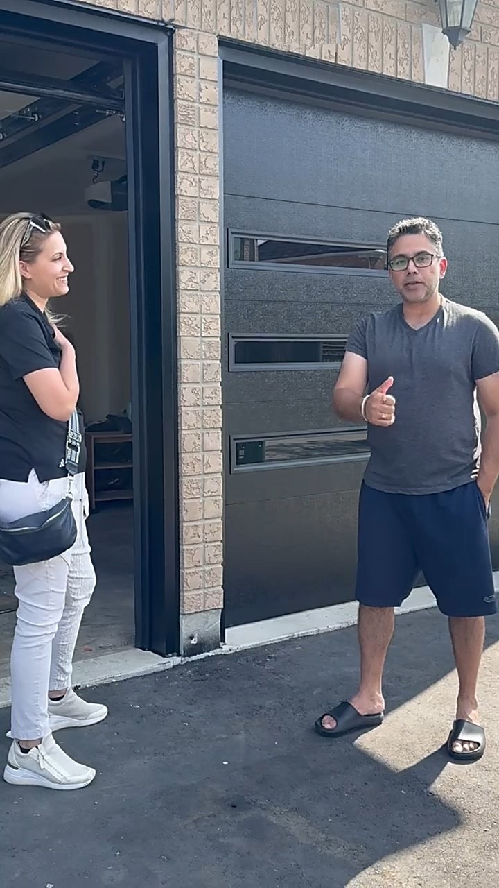 Garage Door Beasts customer outside his new flush garage door in Mississauga