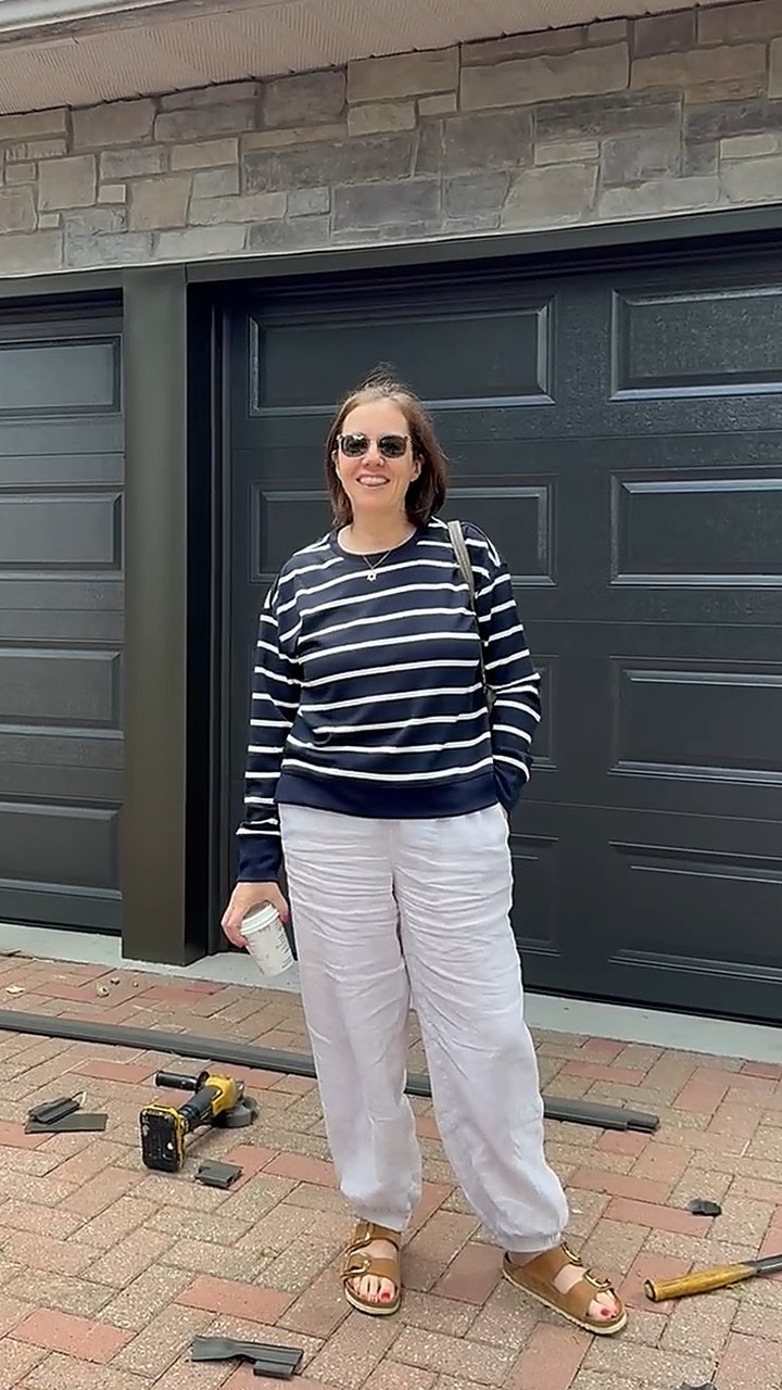 Garage Door Beasts customer outside her new garage door in North York