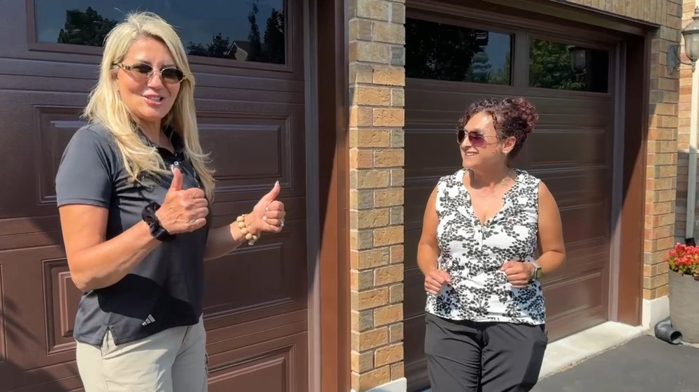 Garage Door Beasts customer outside her new garage doors in Vaughan